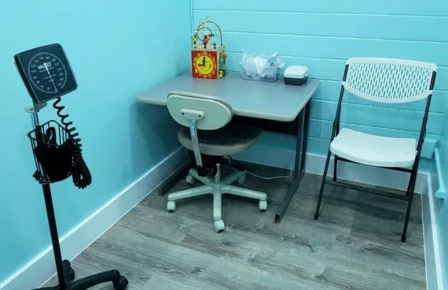 Spacious treatment room with an exam table