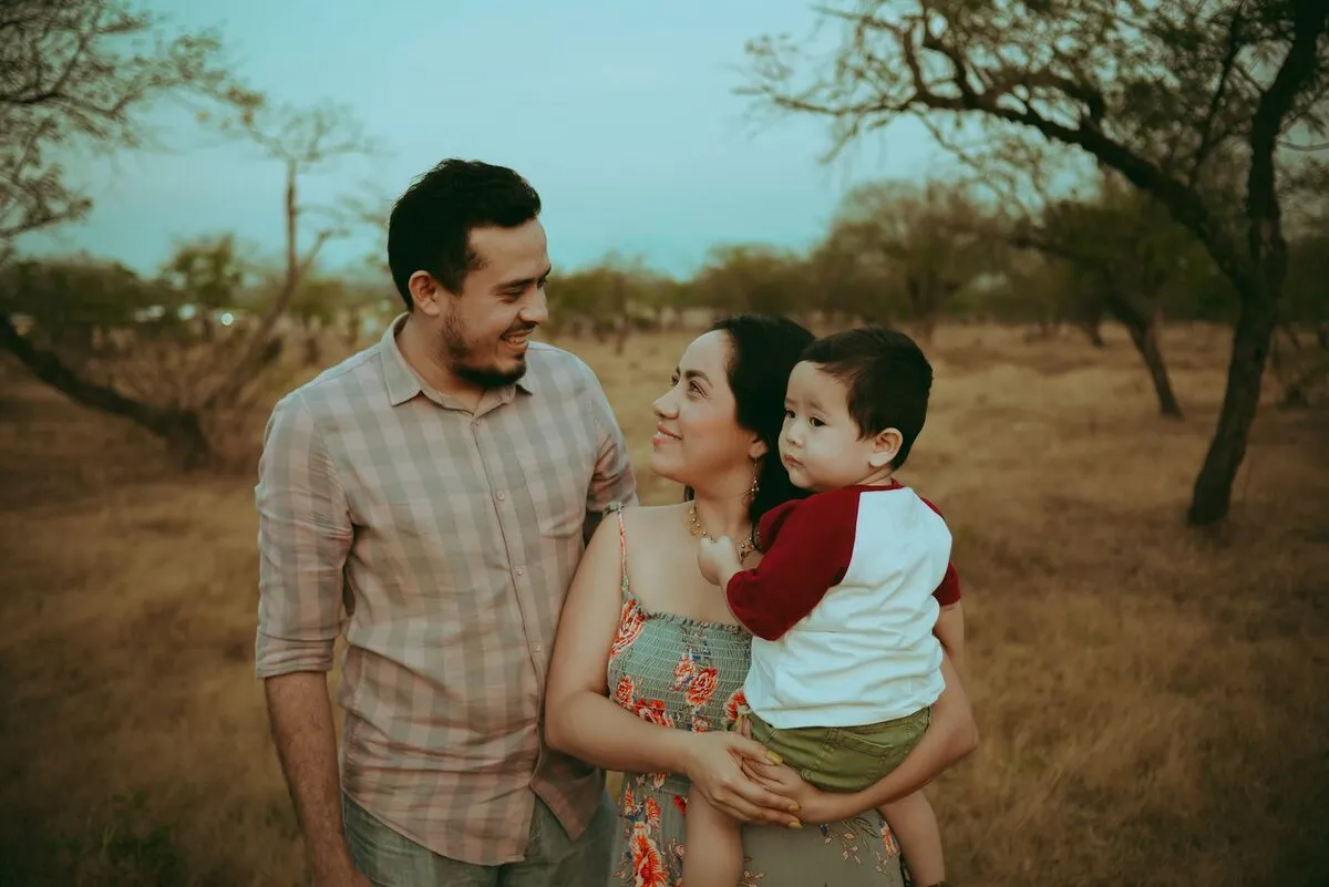 Young family in a warm setting at sunset